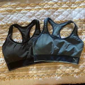 Two Puma sports bras.